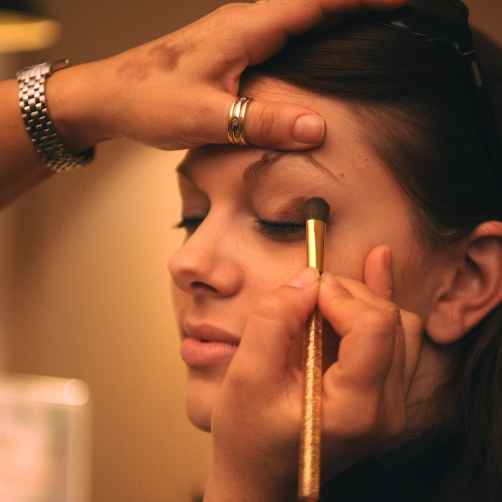 make-up being applied to a womans face